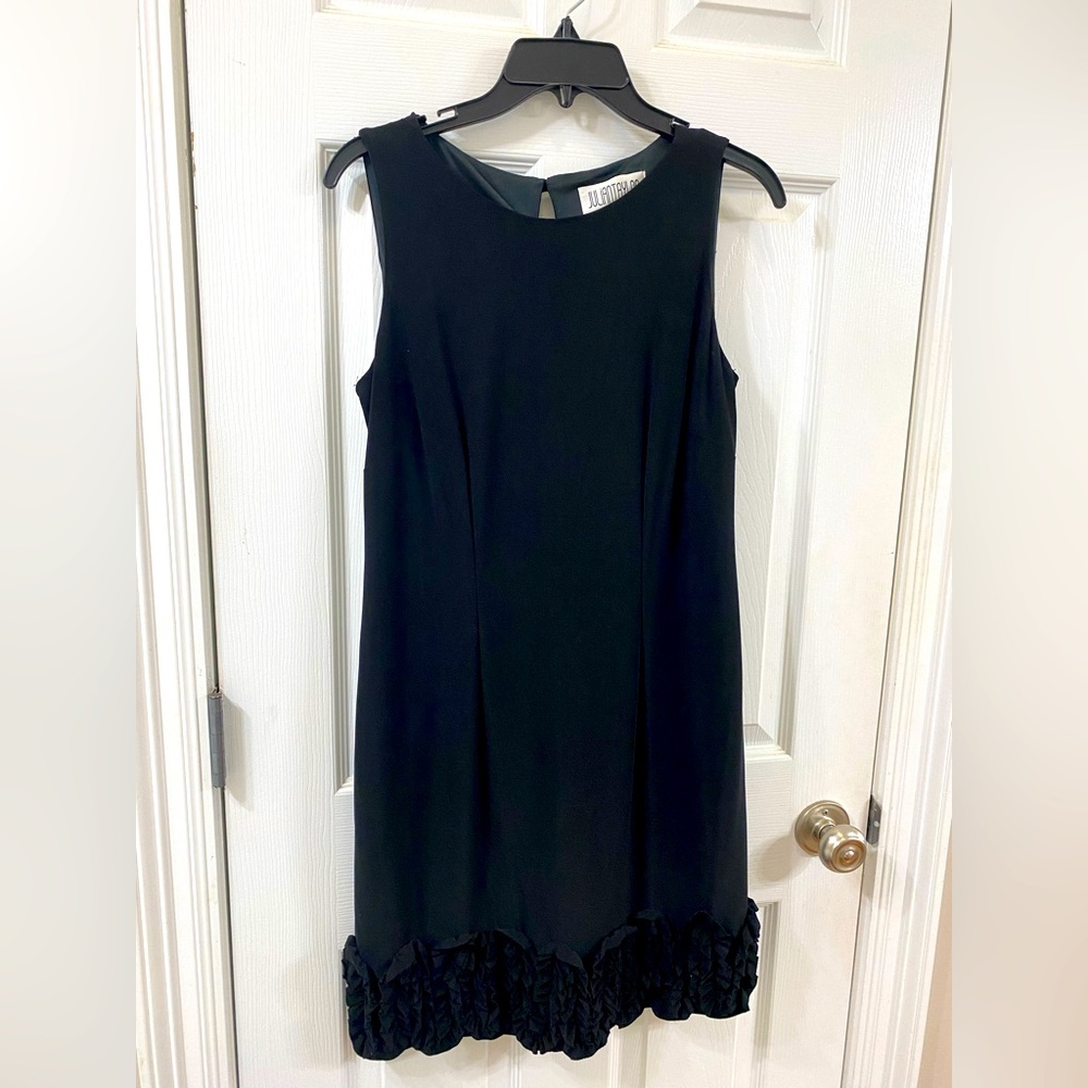 Black, sleeveless dress.  Perfect for wedding or funeral.